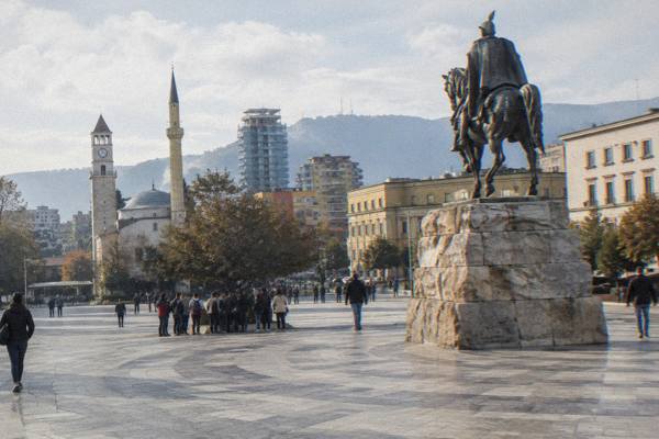 Group meeting a guide in a Tirana square