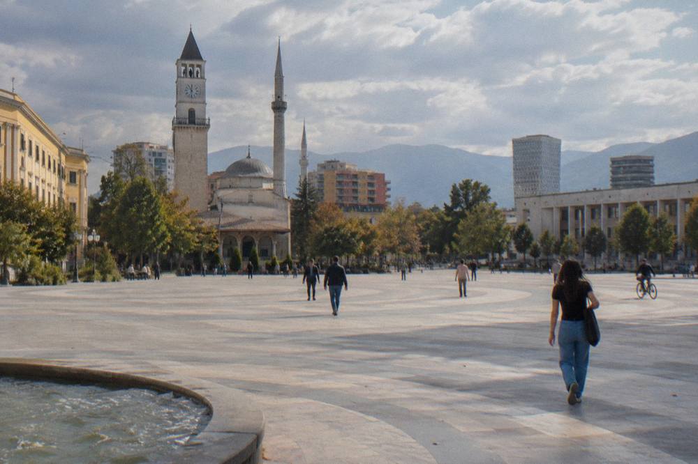 The dome and minarets of the Namazgah Mosque rising above central Tirana