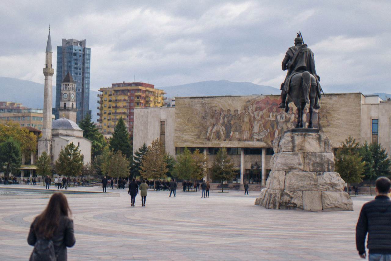 Skanderbeg Square in Tirana with the equestrian statue and the mosaic facade of the closed National History Museum behind it