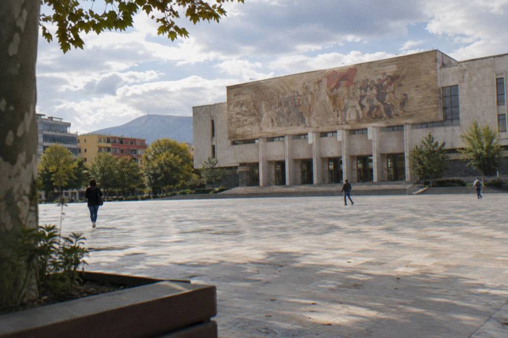 The closed National History Museum facade with its large mosaic facing Skanderbeg Square