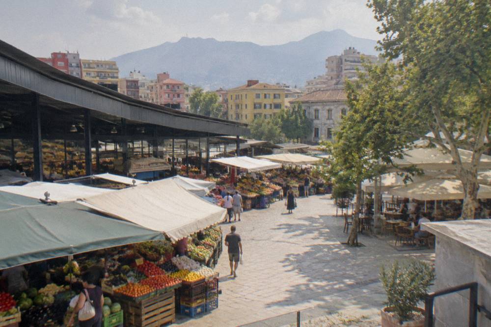 Colourful stalls of fruit and vegetables under the awnings of the New Bazaar in Tirana