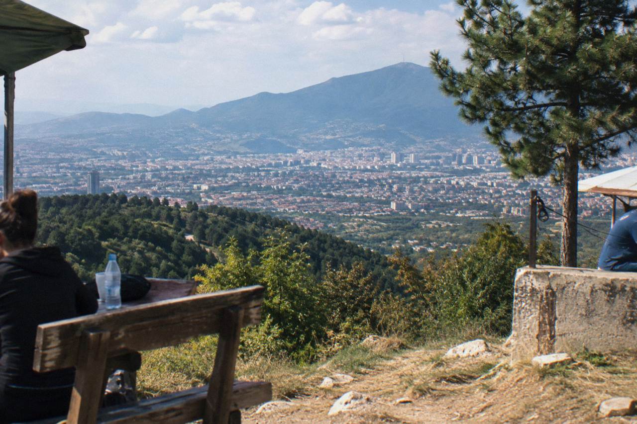 View over Tirana's rooftops with Mount Dajti rising behind the city