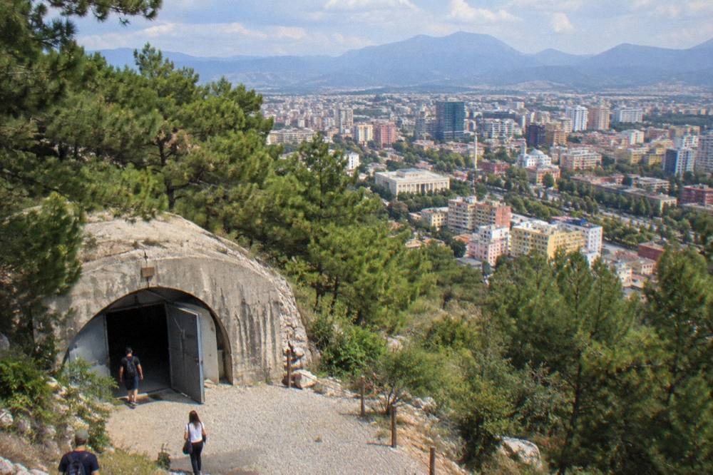 A panoramic view over the rooftops of Tirana from the wooded slopes above the bunker