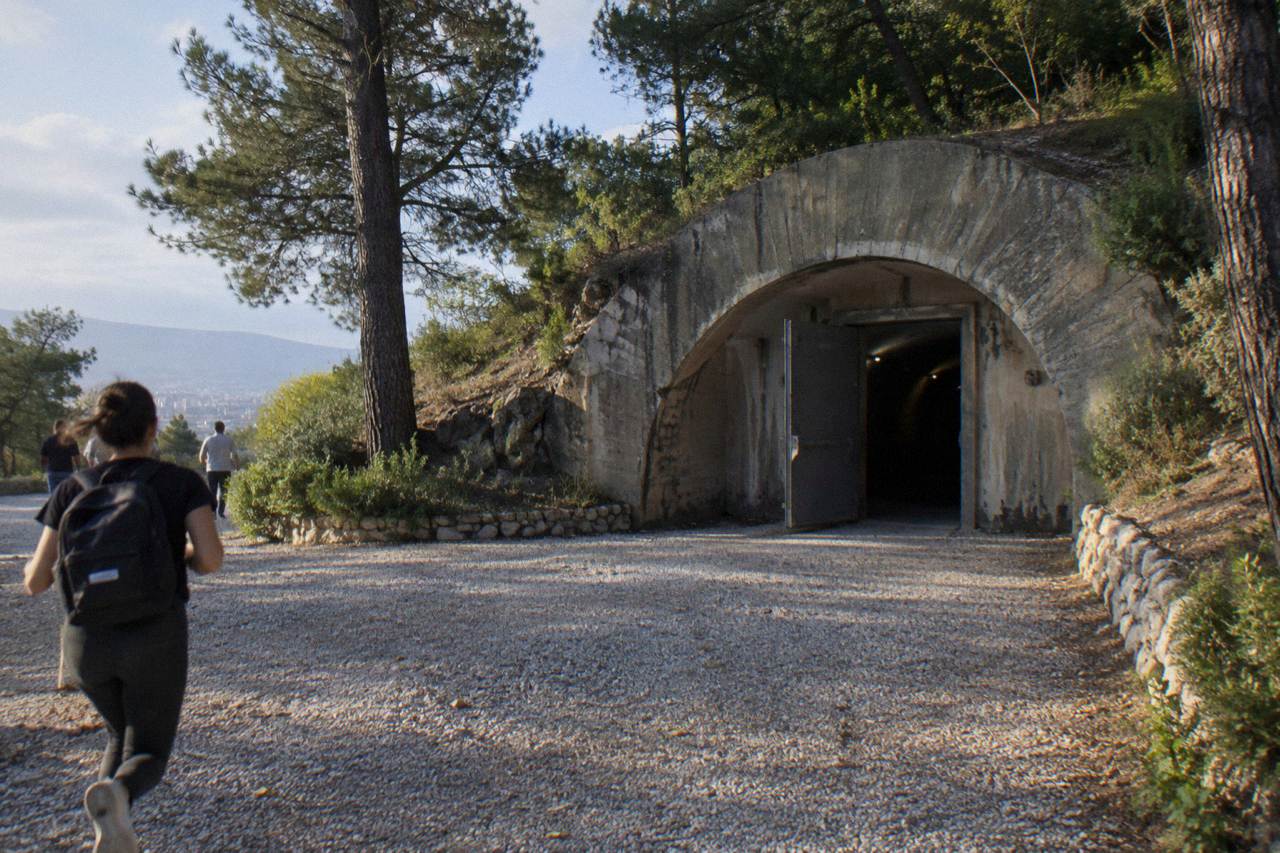 Concrete bunker entrance of a museum on a city street in Tirana