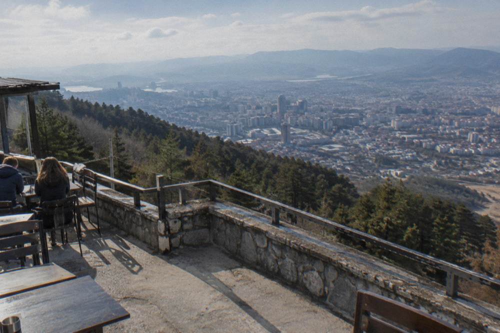 A viewpoint terrace on Mount Dajti overlooking the city of Tirana spread across its basin