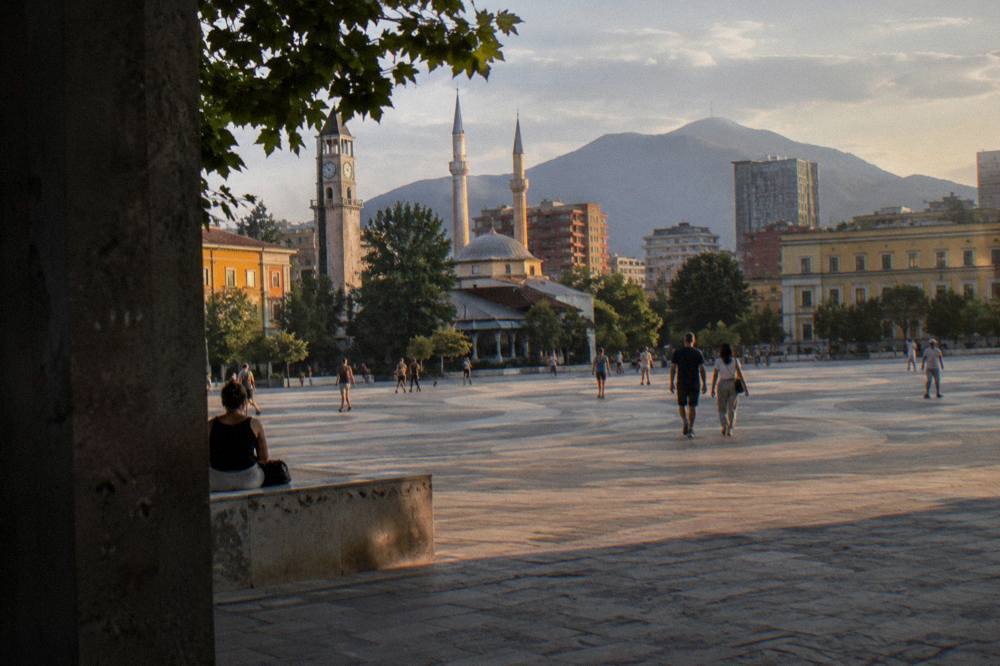 Evening light on the mosque's minarets above the rooftops of Tirana