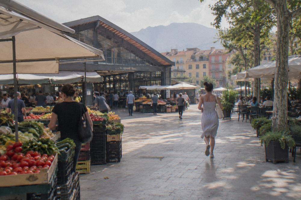 The lively covered market hall of the New Bazaar with fruit and vegetable stalls