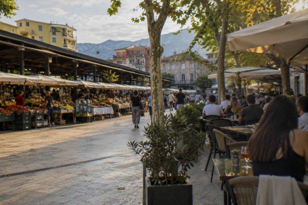 Diners at outdoor tables on a restaurant street near the New Bazaar in the evening in Tirana