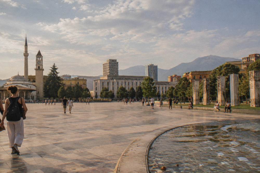 Stone pillars from a former prison standing in a row at the Postblloku memorial in Tirana
