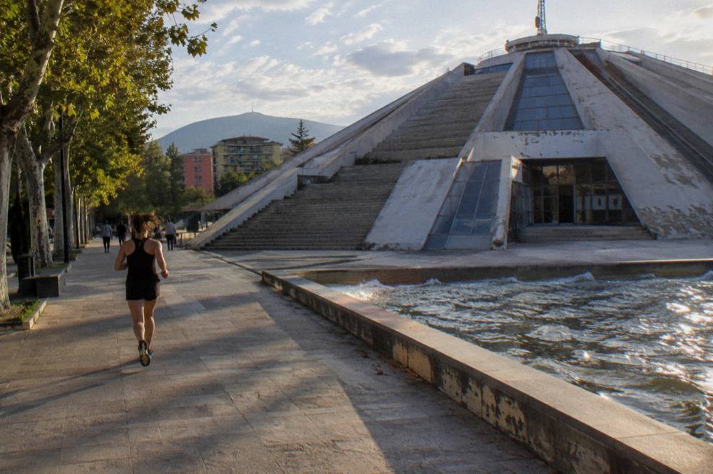 The Pyramid lit by low evening light with long shadows across its steps