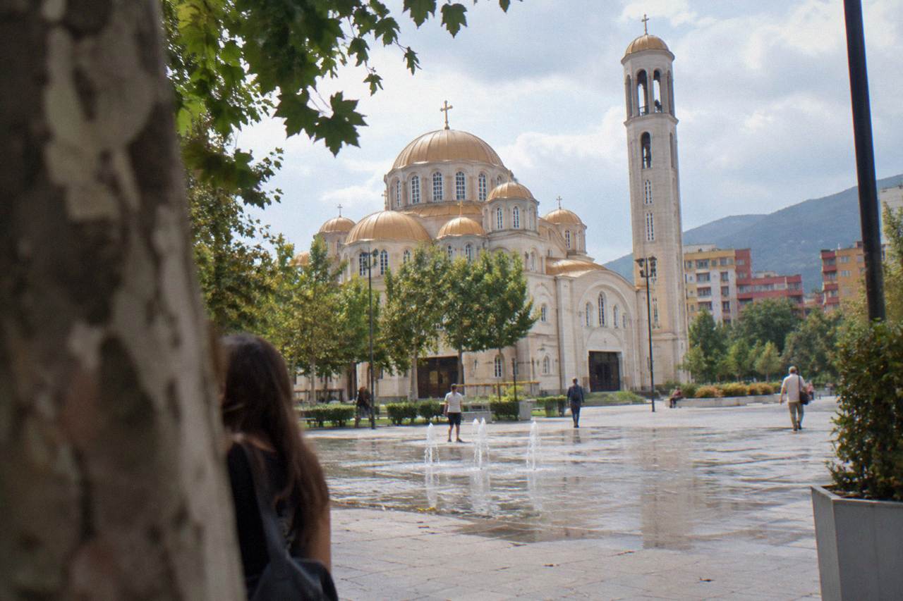 The domed Orthodox Resurrection Cathedral standing beside a plaza in central Tirana