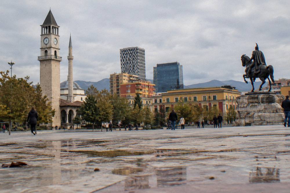 The pedestrian plaza of Skanderbeg Square with the Clock Tower and equestrian statue
