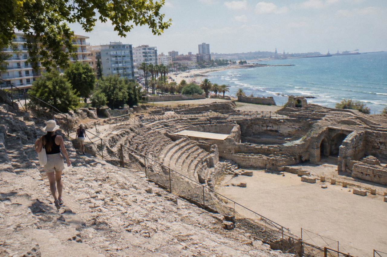 The Roman amphitheatre of Durres seen from its upper seating tiers with the Adriatic Sea in the distance