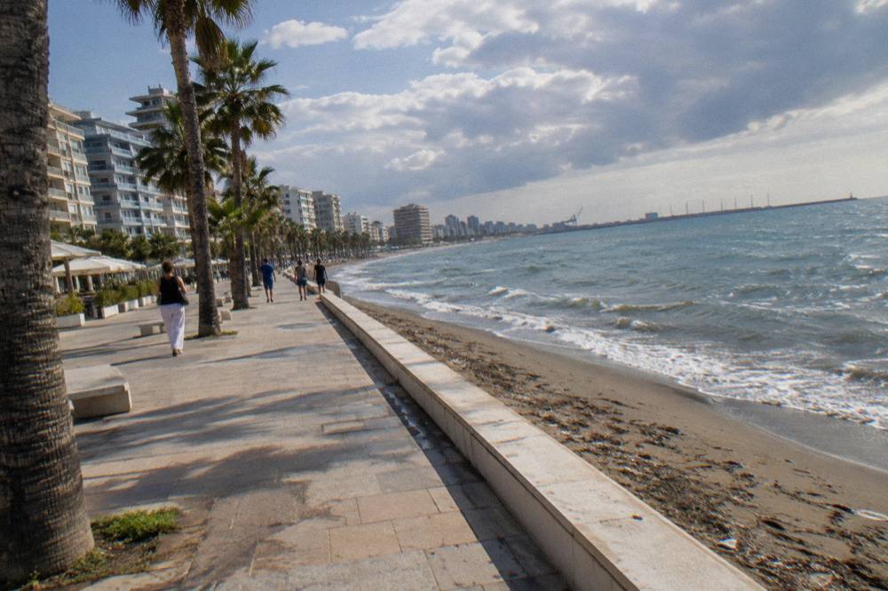 The seafront promenade of Durres with palm trees and the Adriatic Sea beyond