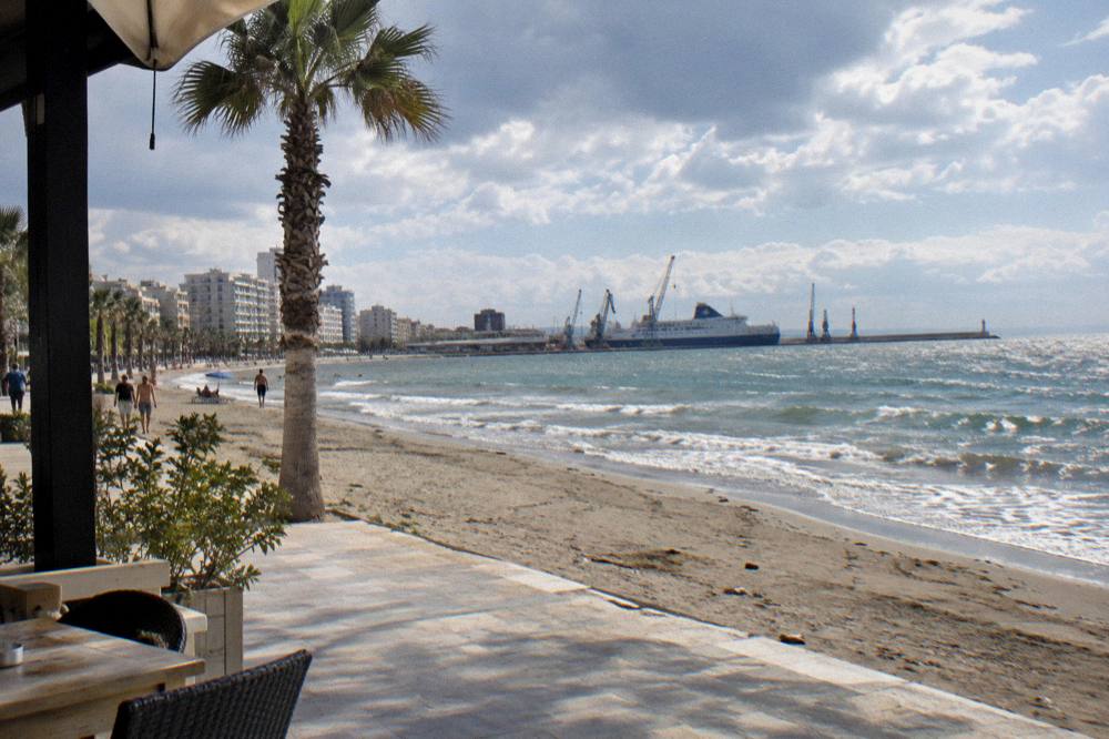 Ferry docked at the port of Durres with cranes and the Adriatic horizon