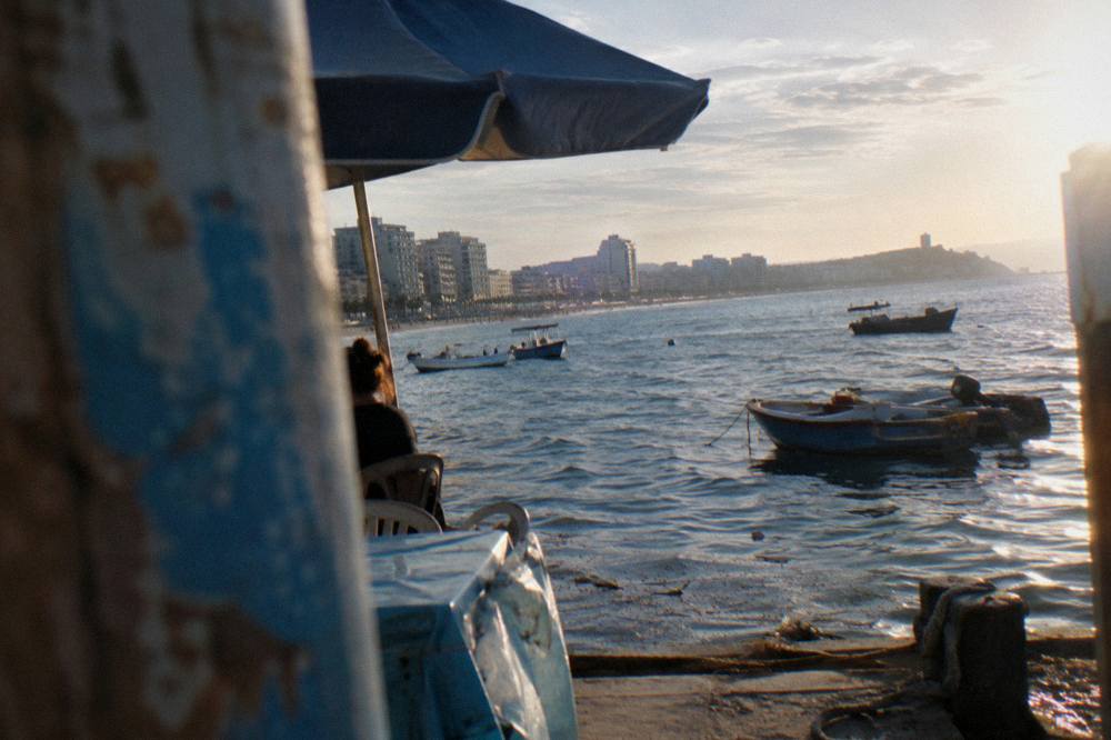 Evening view across Durres bay with fishing boats near the shore