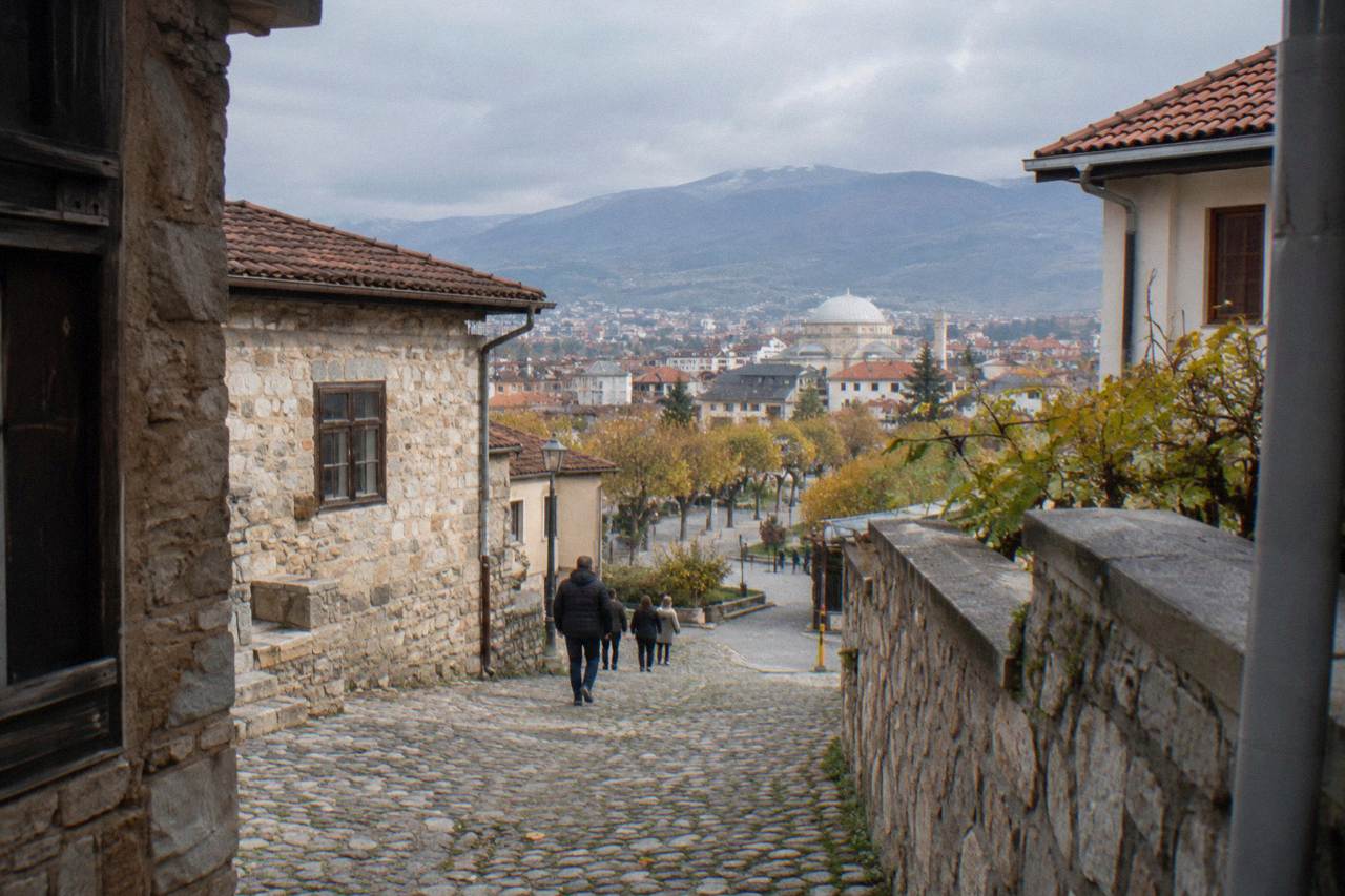Cobbled lane with old stone houses in a southeastern Albanian town