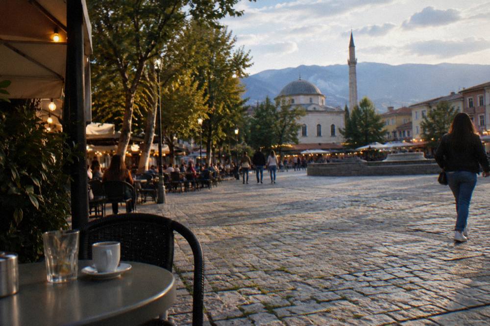 Evening cafe lights on a cobbled square in an Albanian town