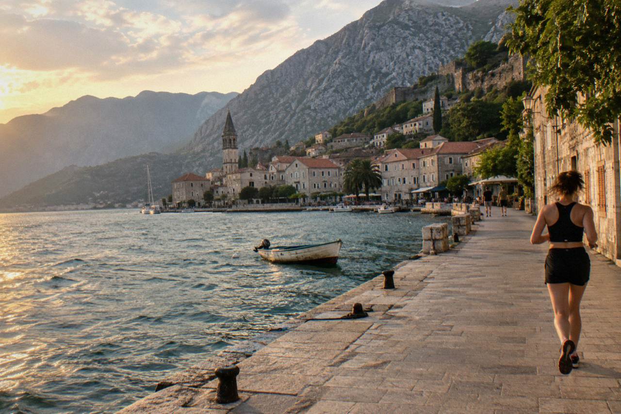 Walled old town of Kotor on the edge of a mountain bay at golden hour