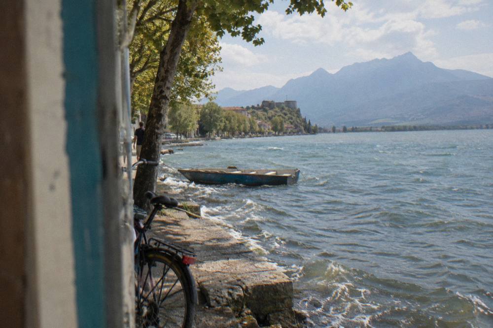 A country road in northern Albania with mountains on the horizon