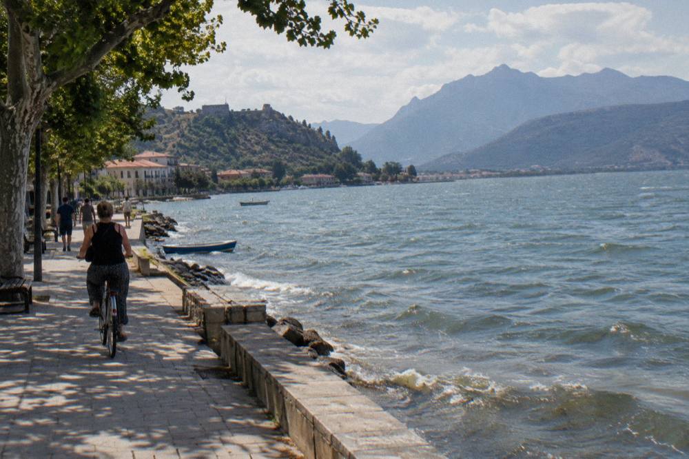 A lake framed by hills with a small village on the shoreline