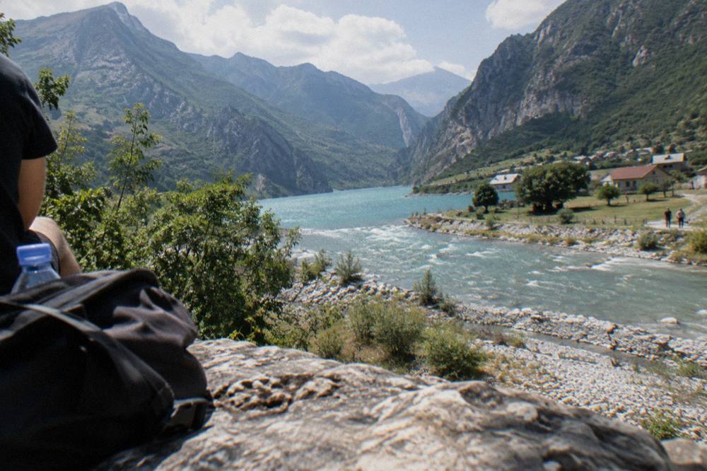 Turquoise water of a mountain reservoir winding between steep canyon walls