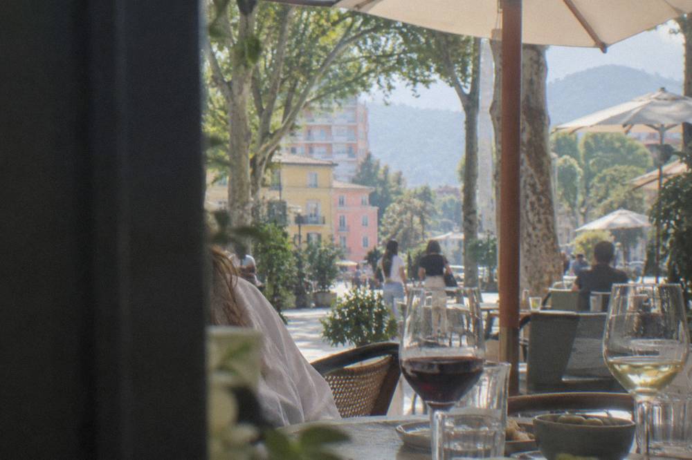 Glasses of red and white wine on a restaurant table in the Blloku district of Tirana