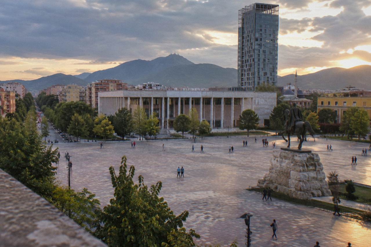 Skanderbeg Square in Tirana seen at dusk with the equestrian statue and the Palace of Culture