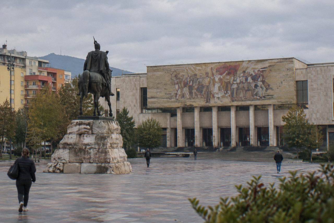 Skanderbeg Square in Tirana with the equestrian statue and the mosaic facade of the closed National History Museum