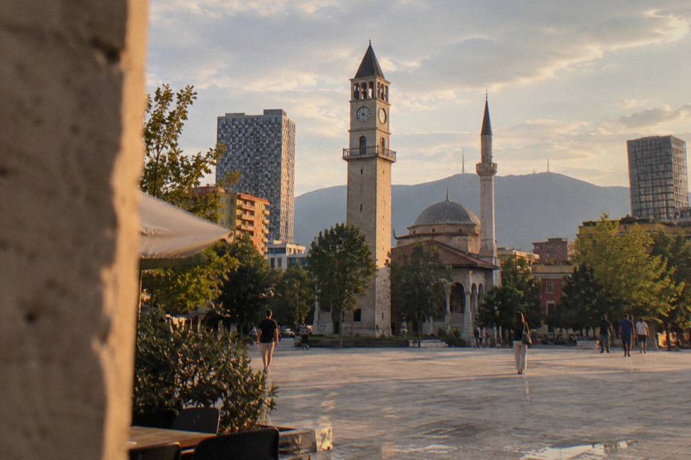 The Clock Tower of Tirana rising beside the mosque on Skanderbeg Square