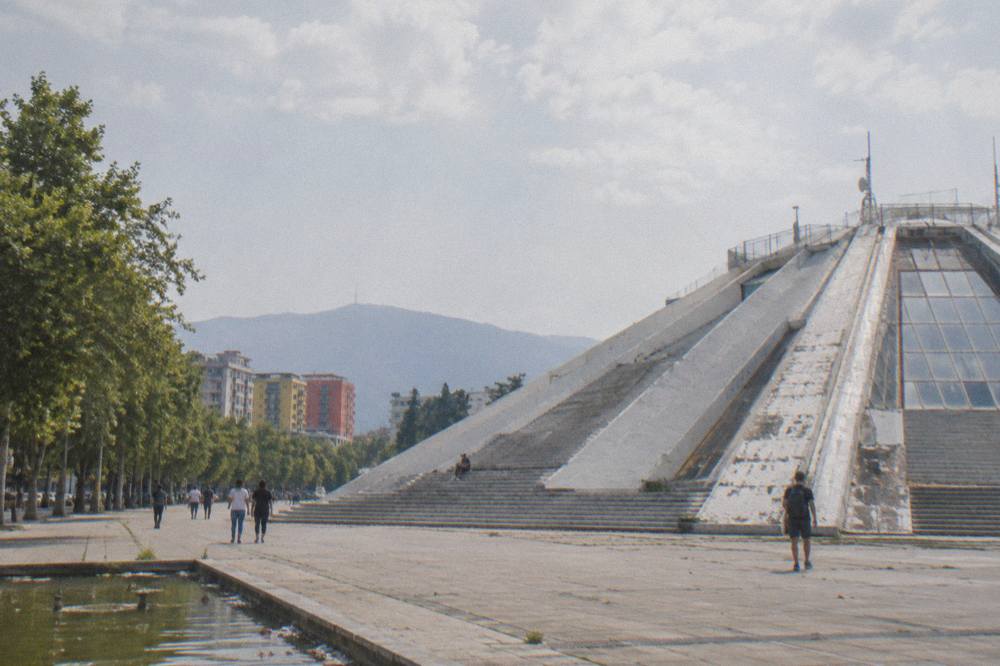 The Pyramid of Tirana seen from below with its sloped concrete steps