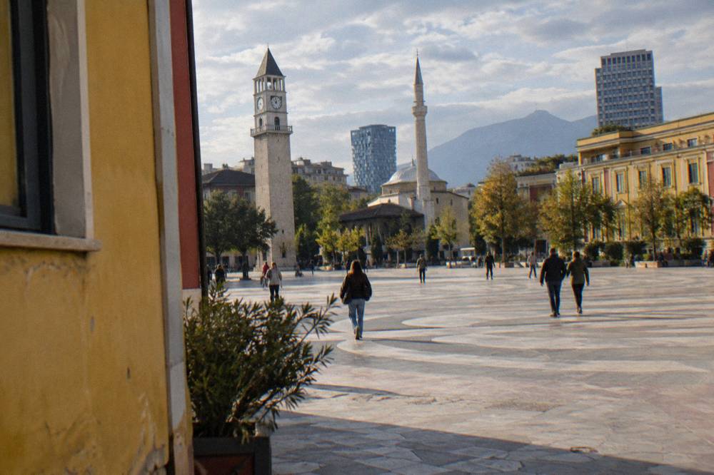 Painted building facades in bright colours on a Tirana street