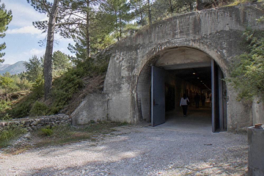 The concrete entrance corridor of a Cold War bunker museum in Tirana