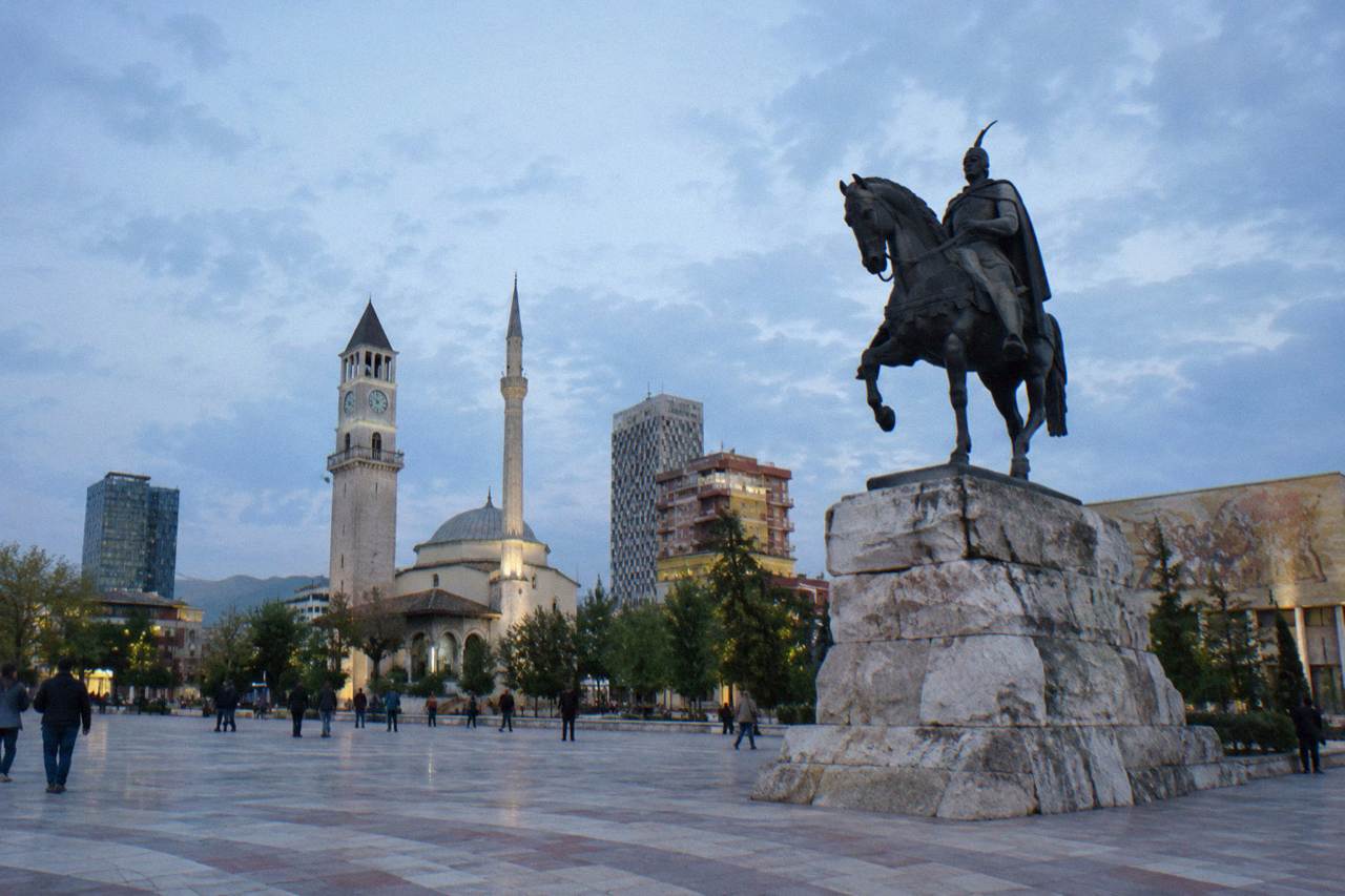 Skanderbeg Square in Tirana with the equestrian statue and the mosaic museum facade in daylight