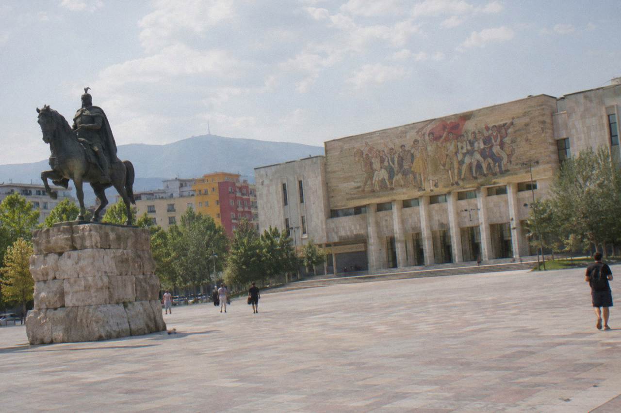 Skanderbeg Square in Tirana with the equestrian statue and the mosaic facade of the National History Museum