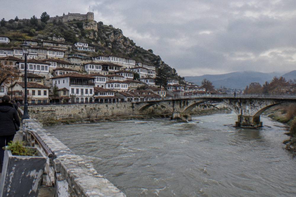 Whitewashed houses climbing the hillside inside Berat old town