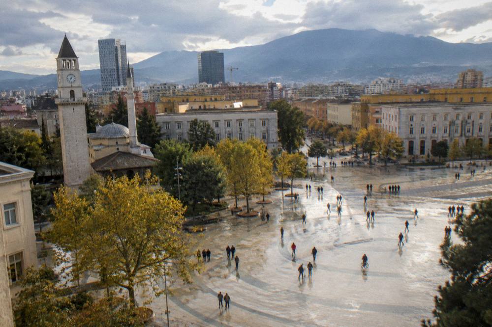 Autumn light over Tirana rooftops with Mount Dajti in the distance