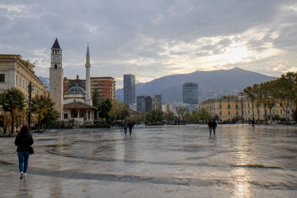 The Tirana city skyline with Mount Dajti behind it in evening light